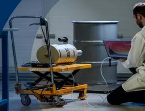 A Veolia engineer performing some nuclear measurements using a device