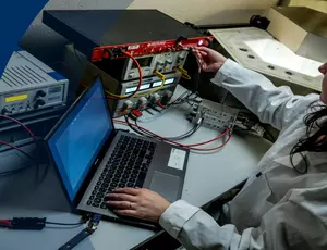 An engineer performing some nuclear measurements with an equipment